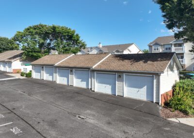 A row of single-car garages in the McDowell Creek Court apartment community.